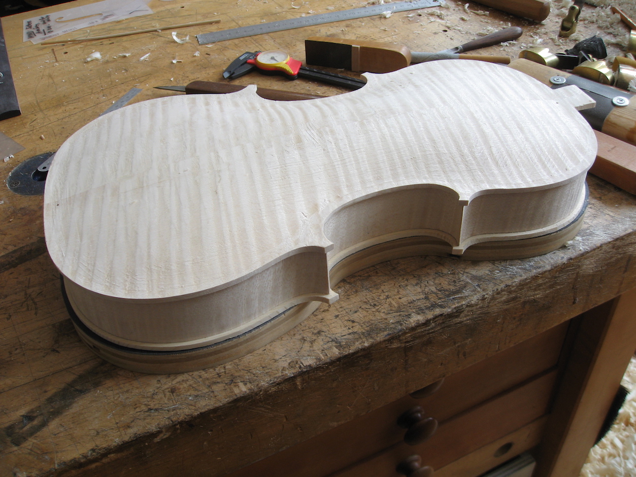 The edge profile is refined in preparation to inlay the purfling