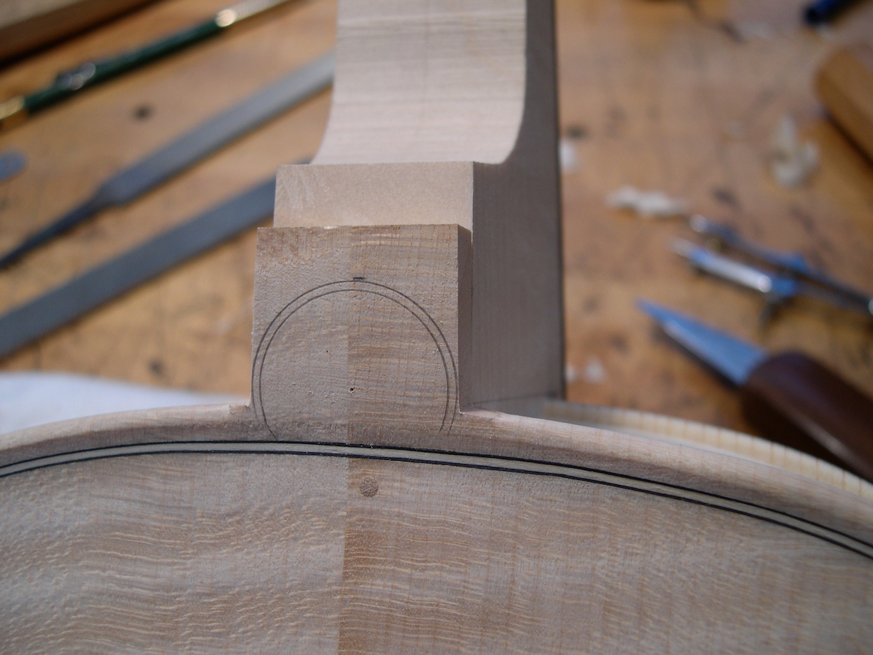 As the neck reaches it’s final fit the button is marked in preparation for final shaping